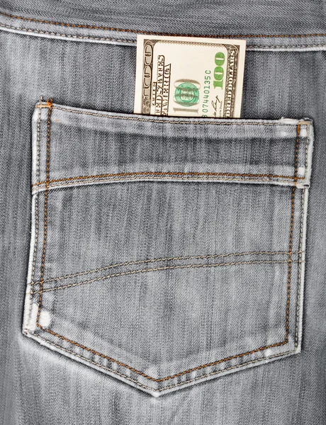 A hundred dollar bills sticking in the back pocket of denim blac — Stock Photo, Image