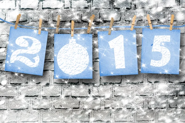 Snow-covered paper numbers of new 2015 with snow on abstract bac — Stock Photo, Image