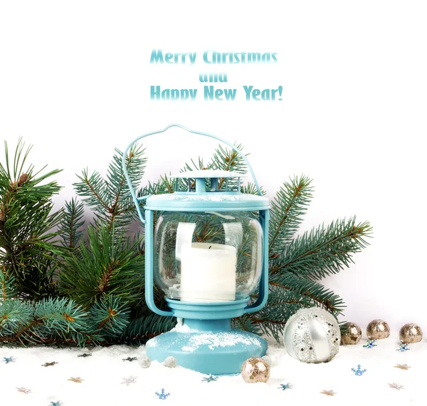 Snowy blue lantern and Christmas balls on the background of fir — Stock Photo, Image