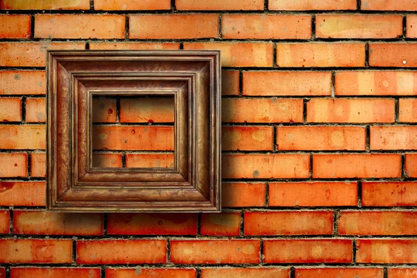 Molduras de madeira vintage para fotos na parede de tijolo velho — Fotografia de Stock