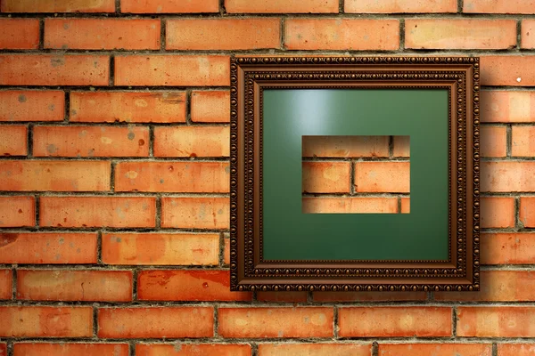 Vintage wooden frames for pictures on old brick wall — Stock Photo, Image