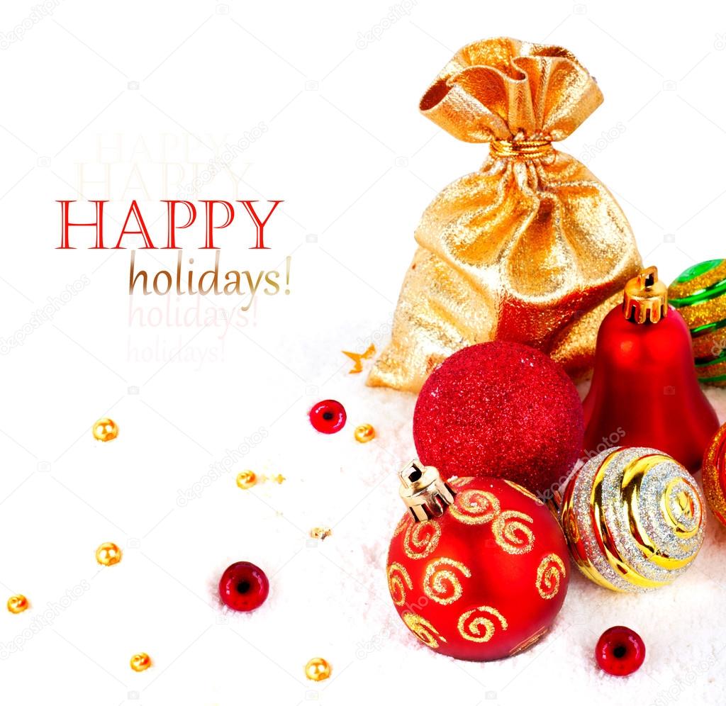 Red christmas ball and golden bag with gifts isolated on white b