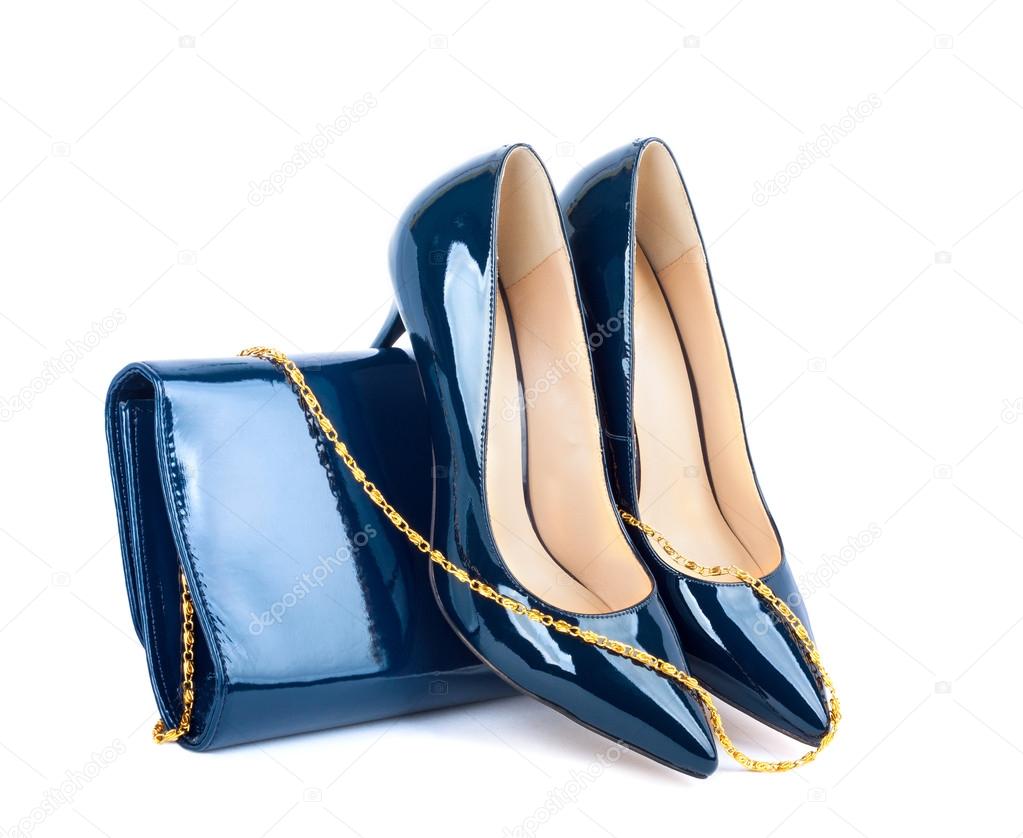 Beautiful blue shoes with clutches on white isolated background