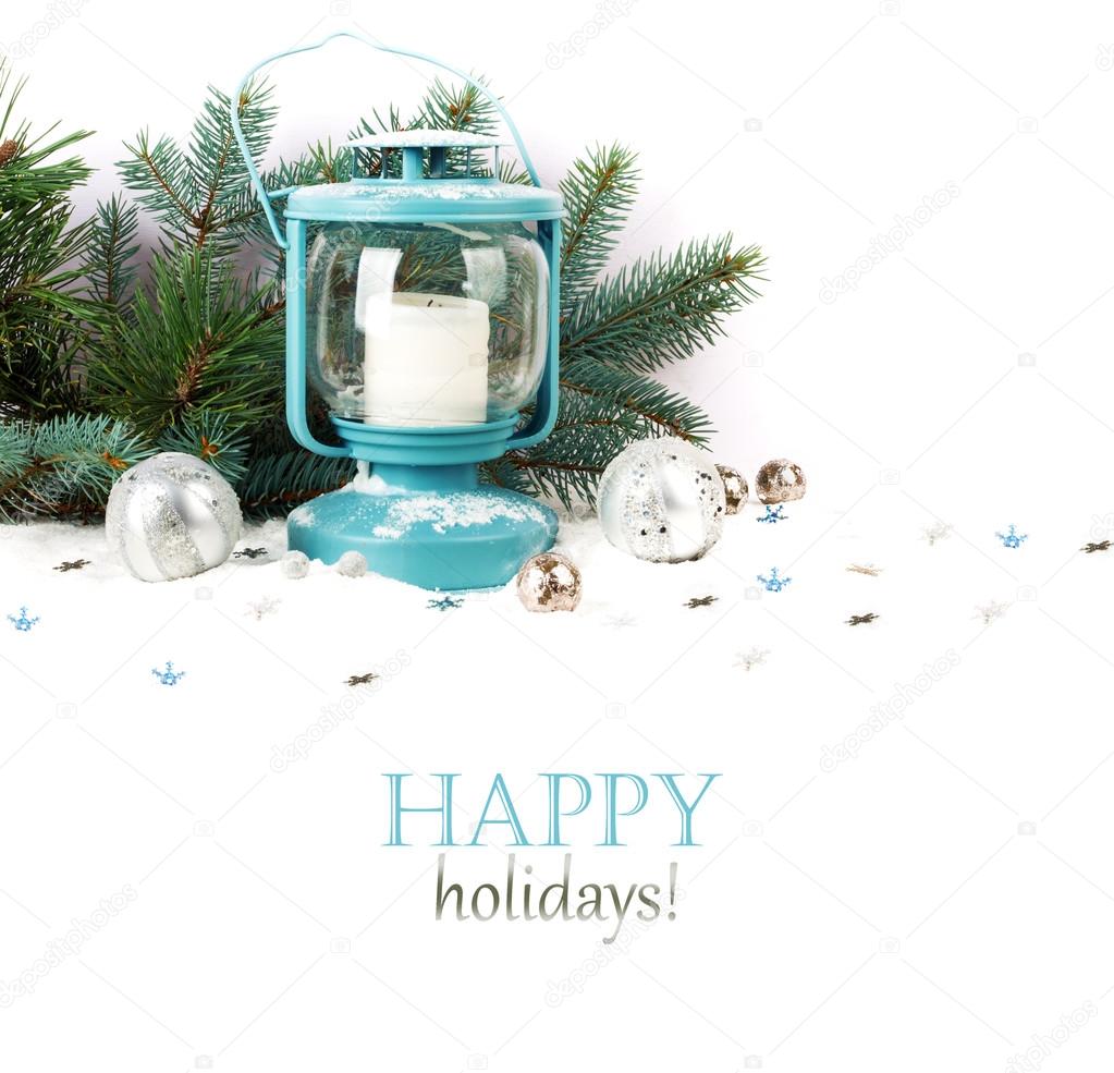 Snowy blue lantern and Christmas balls on the background of fir 