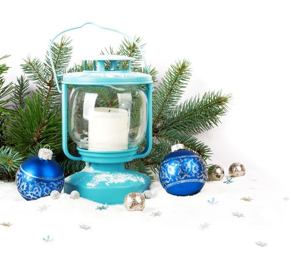 Snowy blue lantern and Christmas balls on the background of fir — Stock Photo, Image