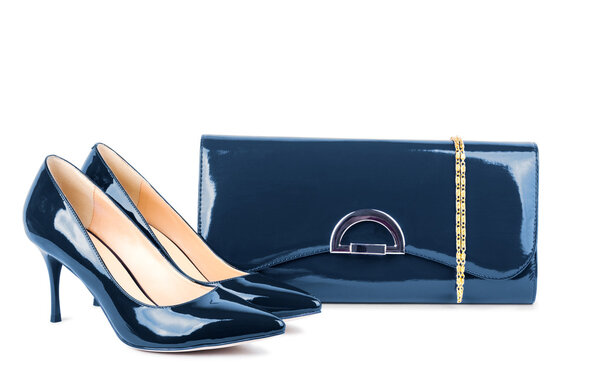 Beautiful blue shoes with clutches on white isolated background