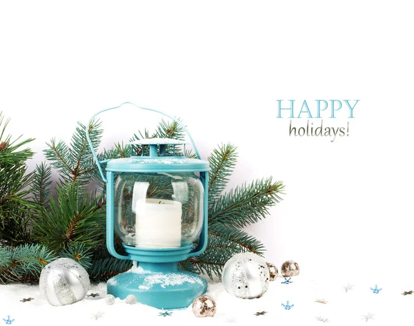 Snowy blue lantern and Christmas balls on the background of fir — Stock Photo, Image