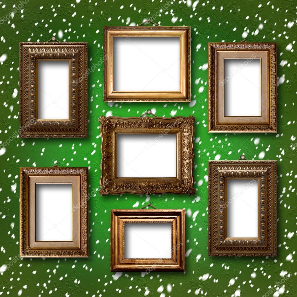 Gilded wooden frames for pictures on abstract blue background