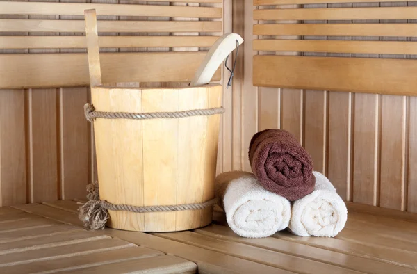 Traditional wooden sauna for relaxation with bucket of water and — Stock Photo, Image
