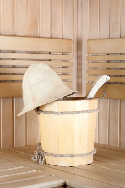 Traditional wooden sauna for relaxation with bucket of water — Stock Photo, Image