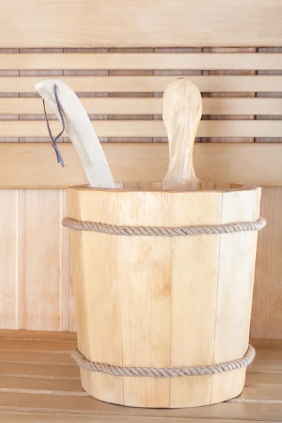 Traditional wooden sauna for relaxation with bucket of water — Stock Photo, Image