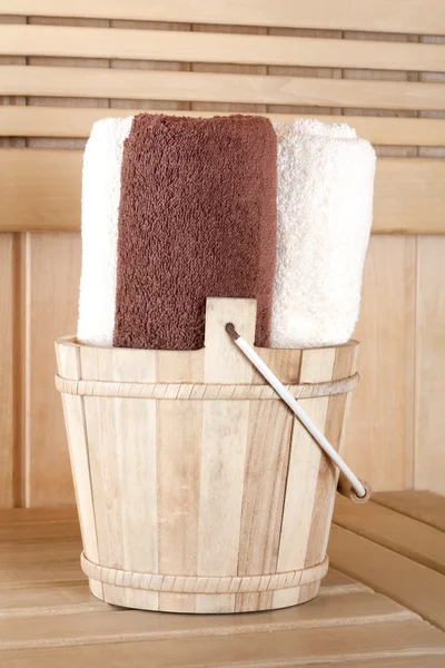 Traditional wooden sauna for relaxation with bucket of water and — Stock Photo, Image