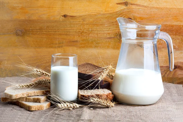 Bread from rye and wheat flour of rough grinding and glass of fr — Stock Photo, Image