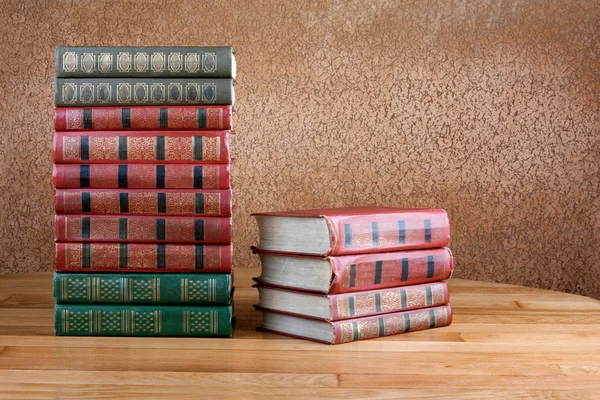 Richly decorated volumes of books with a gold lettering on the b — Stock Photo, Image