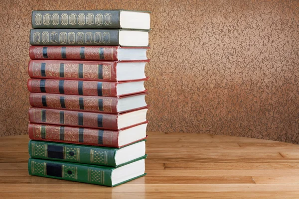 Richly decorated volumes of books with a gold lettering on the b — Stock Photo, Image