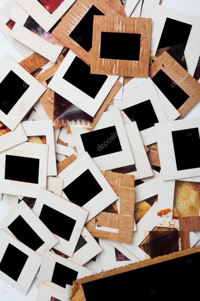 Set of old slides, photos and film on the table