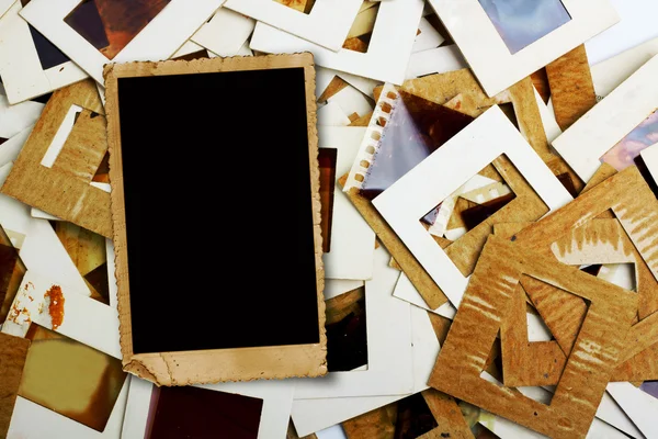 Set of old slides, photos and film on the table — Stock Photo, Image