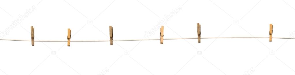 Old wooden clothespins on a rope isolated