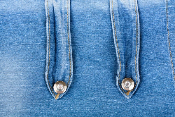 Old denim background with metal buttons — Stock Photo, Image