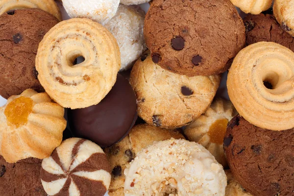 Stack of fresh cookies with chocolate and coconut flakes — Stock Photo, Image