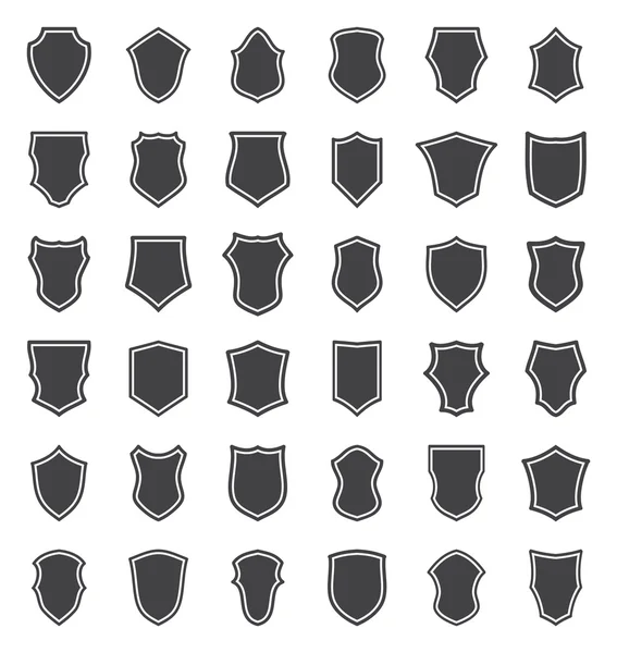 Набір чорних щитів — стоковий вектор