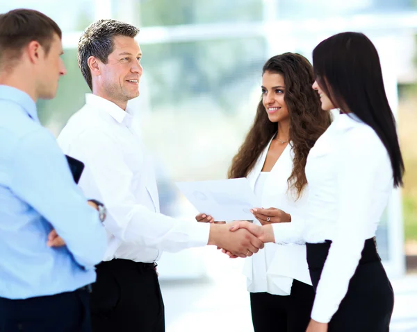 businessman shaking hands to seal a deal with his partner