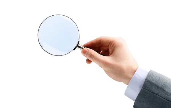 Magnifying glass in hand — Stock Photo, Image