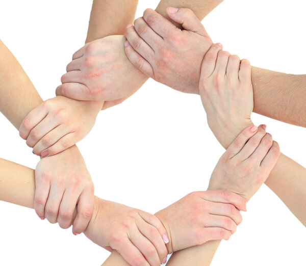 Business people joining hands in a circle in the office