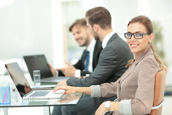 Beautiful modern businesswoman  working with  her colleagues on