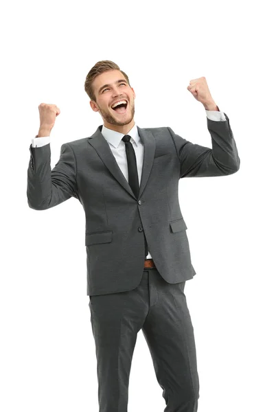 Бізнесмен святкує зі своїми кулаками, піднятими в повітрі і — стокове фото