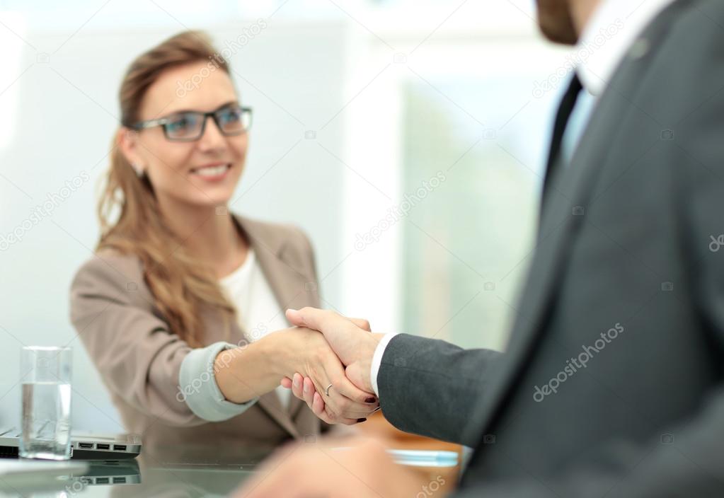 Business woman shaking hand to  her  partner