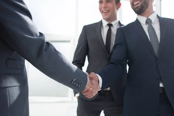 Handshake of business partners in a modern office — Stock Photo, Image