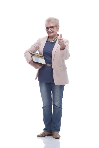 En pleine croissance. vieille dame souriante avec une pile de livres — Photo