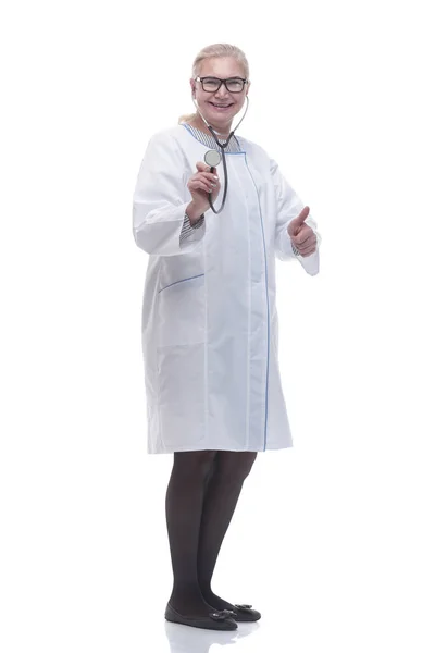 In full growth. female doctor showing her stethoscope. — Stock Photo, Image