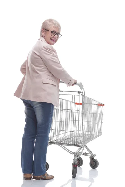 Rear view. adult woman with shopping cart looking at the camera. — Stock Photo, Image