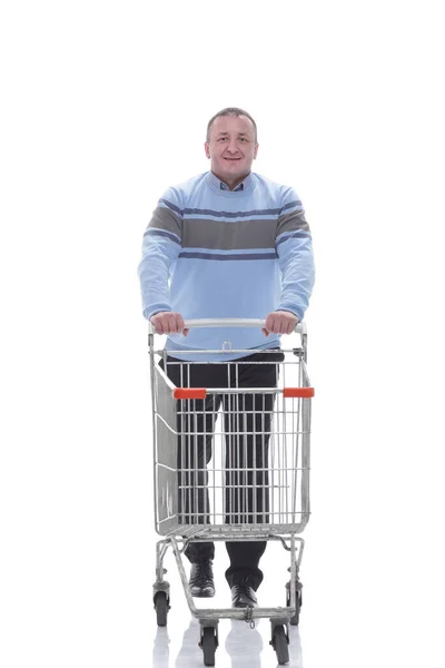 In full growth. confident casual man with shopping cart — Stock Photo, Image