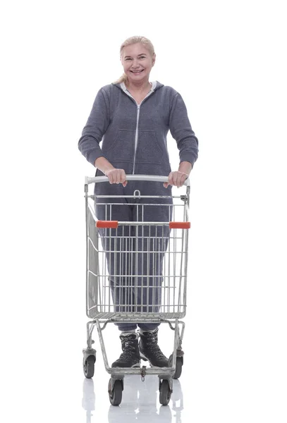 In full growth. smiling casual woman with shopping cart — Stock Photo, Image