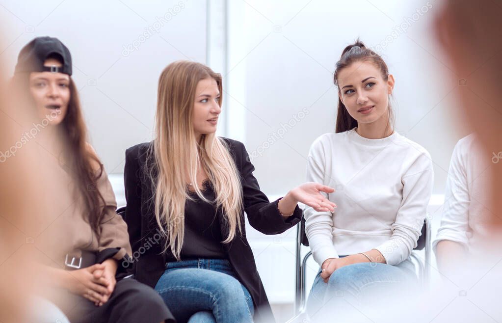 close up. young people discussing something at a group meeting