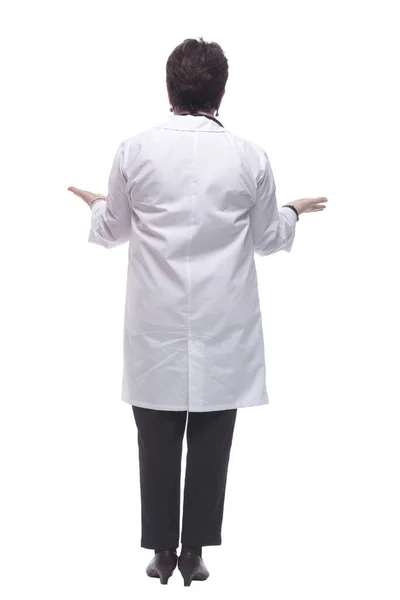 Οπίσθια όψη. γυναίκα γιατρός κοιτάζοντας μια λευκή κενή οθόνη — Φωτογραφία Αρχείου