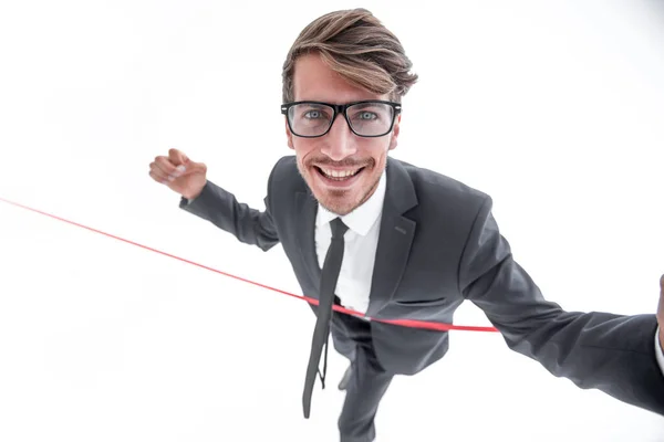 Hombre de negocios alegre cruzando la línea de meta roja —  Fotos de Stock