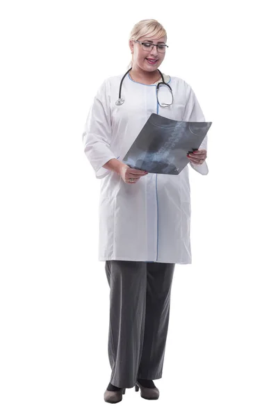 Smiling woman doctor looking at an x- ray. isolated on a white — Stock Photo, Image