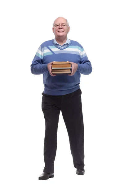 V plném růstu. starší muž se zásobníkem knih kráčející vpřed — Stock fotografie