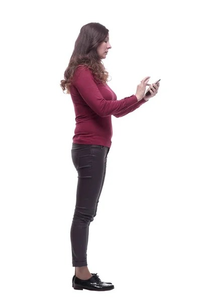 Side view. casual young woman choosing a contact in her smartphone — Stock Photo, Image