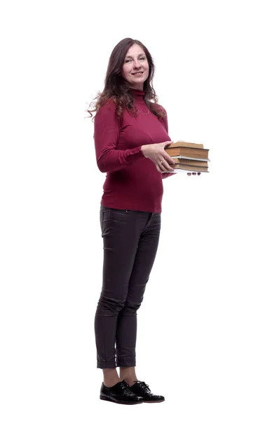In vollem Wachstum. Lächelnde junge Frau mit einem Stapel Bücher — Stockfoto