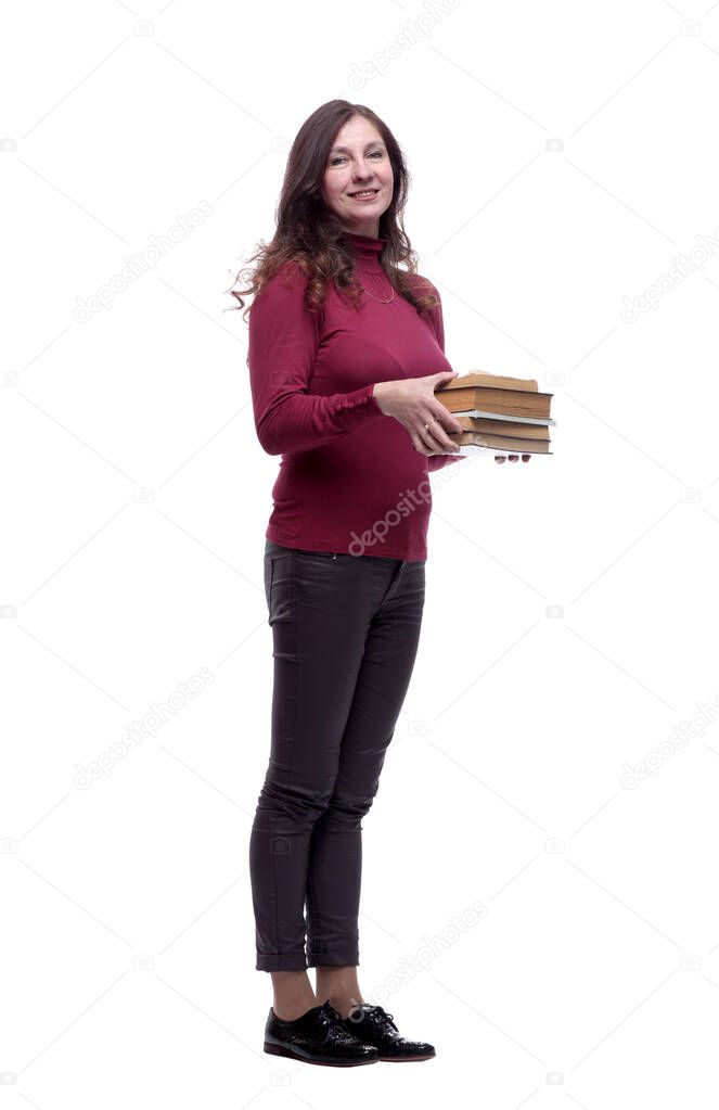 in full growth. smiling young woman with a stack of books