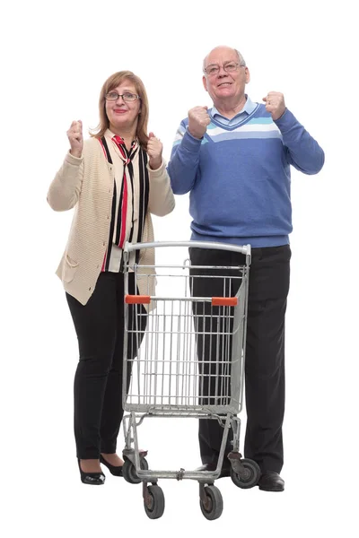 En pleno crecimiento. casual pareja de ancianos con carrito de compras — Foto de Stock