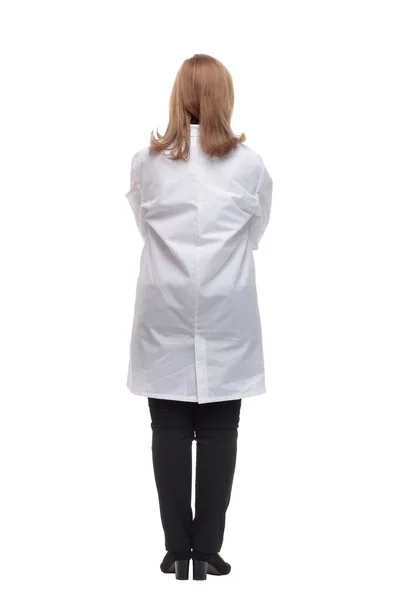 Vista posteriore.medico donna in piedi davanti a un grande schermo bianco — Foto Stock