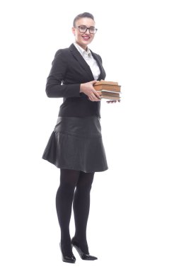 Tam gelişim. Bir yığın kitabı olan gülümseyen bir iş kadını.