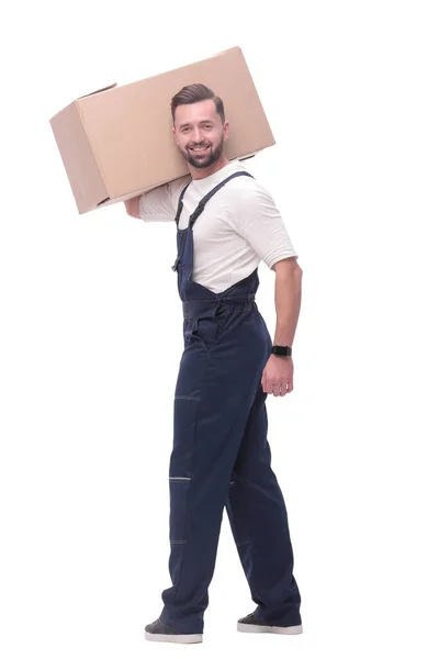 Rear view. a young man with a cardboard box looking at the camera — Stock Photo, Image