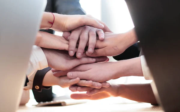 Close up. young employees making a tower out of their hands — Stock Photo, Image